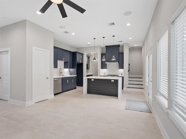 825 Paul Quinn St Unit E, Houston, TX 77091 - kitchen featuring stainless steel appliances, ceiling fan, light countertops, hanging light fixtures, and a kitchen island