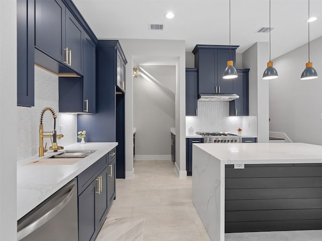 825 Paul Quinn St Unit E, Houston, TX 77091 - kitchen featuring appliances with stainless steel finishes, decorative backsplash, under cabinet range hood, light stone counters, and hanging light fixtures