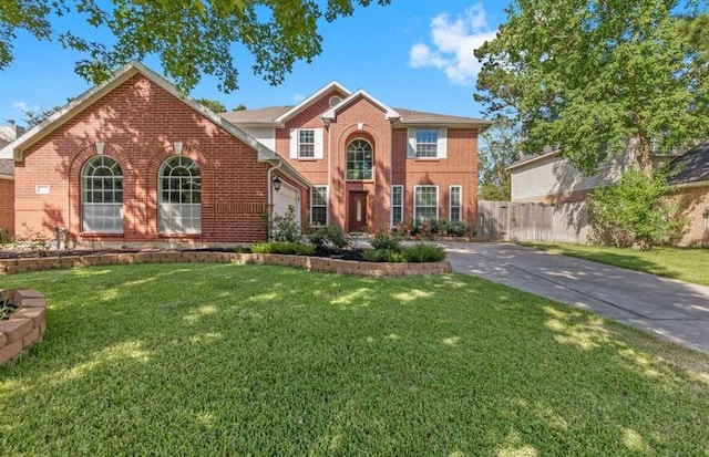 9110 Memorial Creek Dr, Spring, TX 77379 - view of front of home featuring brick siding, an attached garage, and concrete driveway