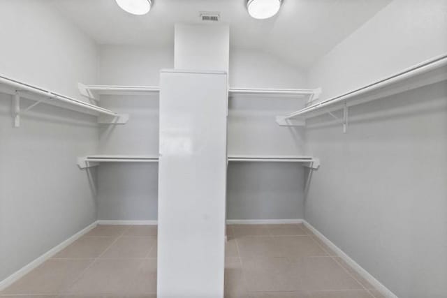 9110 Memorial Creek Dr, Spring, TX 77379 - spacious closet featuring tile patterned flooring