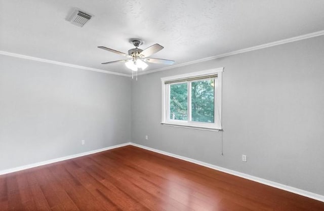 9110 Memorial Creek Dr, Spring, TX 77379 - spare room with ceiling fan, crown molding, and wood finished floors