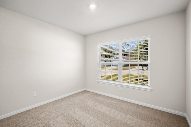 10391 Red Cardinal Dr, Cleveland, TX 77328 - carpeted empty room featuring baseboards and recessed lighting