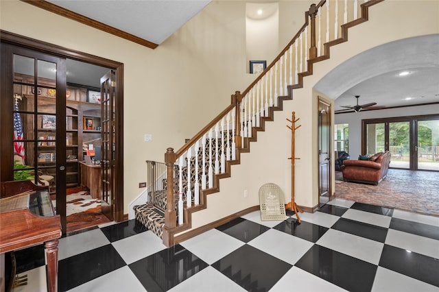 2790 Derby Ln, Madisonville, TX 77864 - stairway featuring tile patterned floors, a ceiling fan, crown molding, arched walkways, and recessed lighting