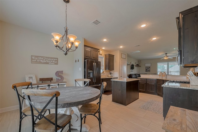 9119 Anna St, Needville, TX 77461 - dining space featuring recessed lighting, a chandelier, a ceiling fan, and light wood finished floors