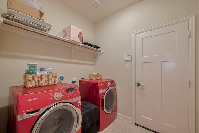 9119 Anna St, Needville, TX 77461 - laundry room featuring independent washer and dryer and baseboards