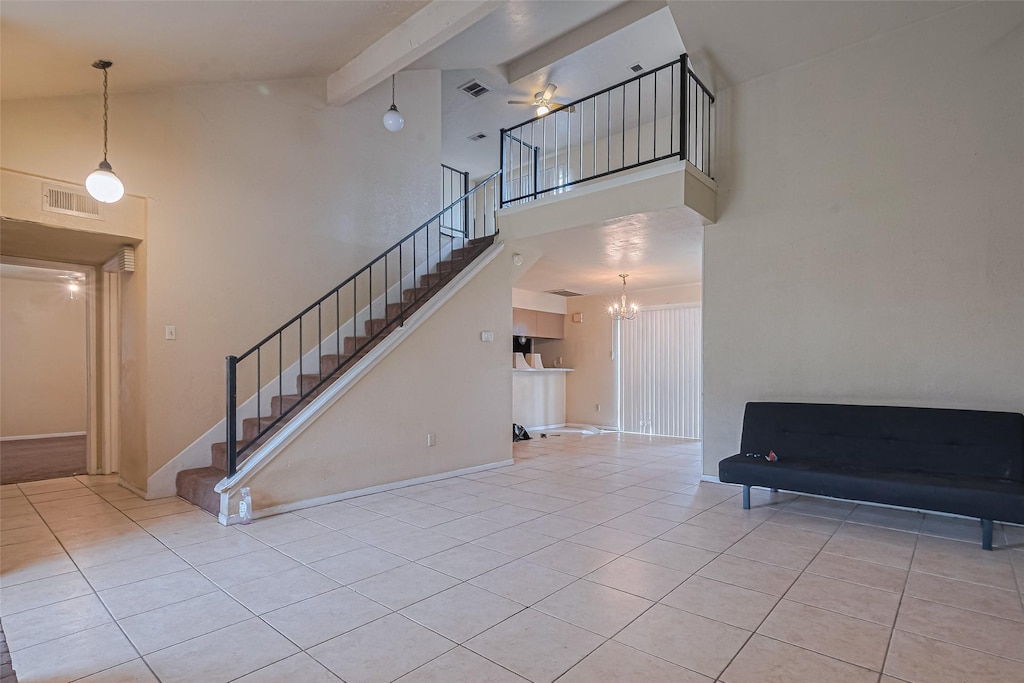 12223 W Village Dr Unit D, Houston, TX 77039 - living area with tile patterned floors, stairway, high vaulted ceiling, a chandelier, and ceiling fan