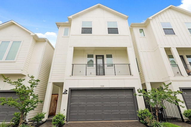 709 Sienna Palm Ln, Houston, TX 77008 - view of property with a garage, decorative driveway, and a balcony