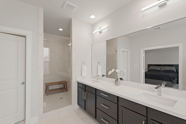 709 Sienna Palm Ln, Houston, TX 77008 - ensuite bathroom with double vanity, a stall shower, tile patterned flooring, and recessed lighting