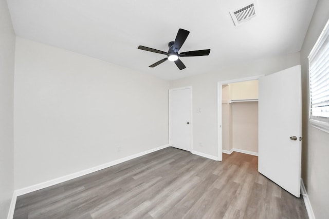 9611 Bertwood St, Houston, TX 77016 - unfurnished bedroom featuring wood finished floors, a closet, and ceiling fan