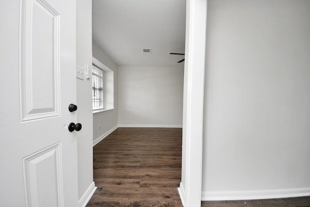 9611 Bertwood St, Houston, TX 77016 - hall featuring dark wood-style flooring and baseboards