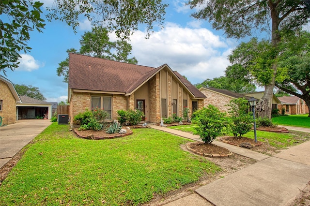 21426 Park York Dr, Katy, TX 77450 - mid-century home with a front yard, brick siding, and a shingled roof