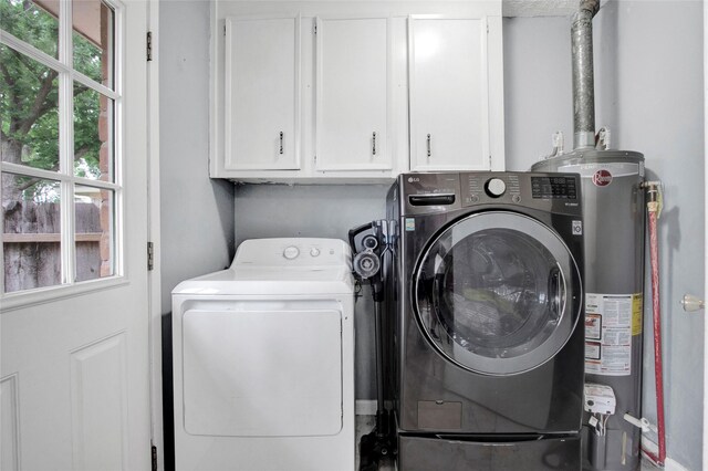 21426 Park York Dr, Katy, TX 77450 - washroom with washer and dryer, cabinet space, and water heater