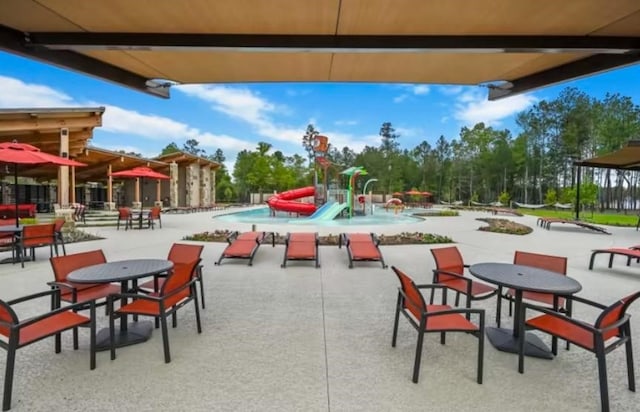 14842 Ash Landing Dr, Conroe, TX 77302 - view of community featuring a patio