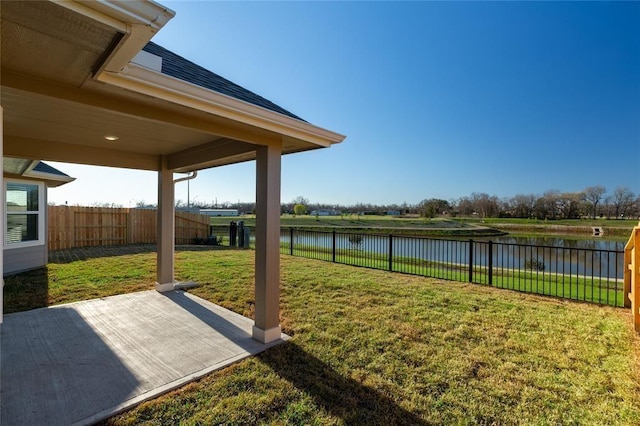1202 Oak Barrel Run, Richmond, TX 77406 - fenced backyard with a water view and a patio
