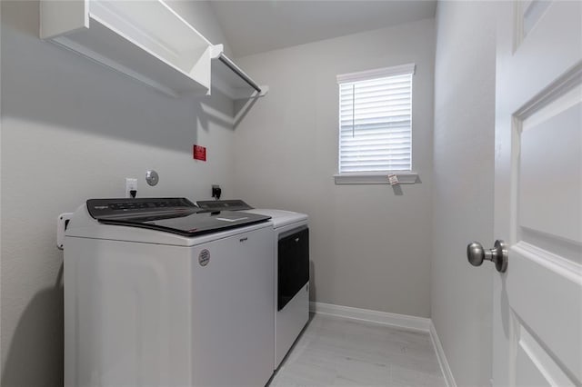 1202 Oak Barrel Run, Richmond, TX 77406 - laundry room with washer and dryer and baseboards
