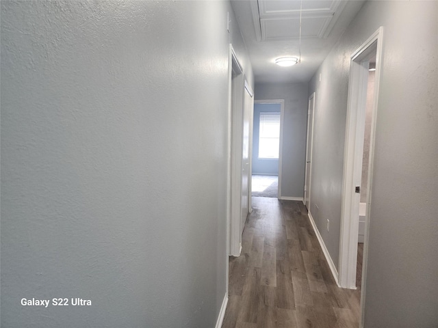 14119 Falling Elm Ln, Houston, TX 77015 - corridor featuring attic access and dark wood-type flooring