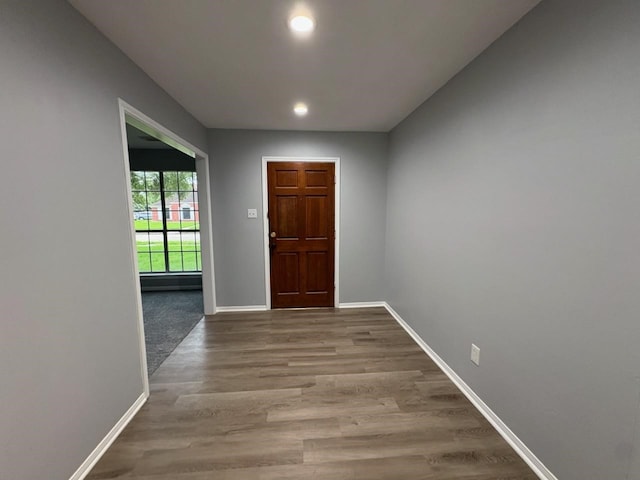 14119 Falling Elm Ln, Houston, TX 77015 - doorway with wood finished floors and recessed lighting