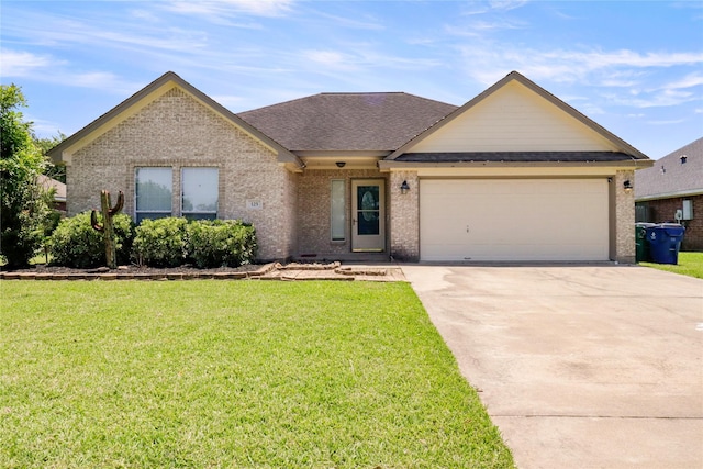 125 Dove Trl, Richwood, TX 77531 - view of front of house featuring brick siding, an attached garage, concrete driveway, and a front yard