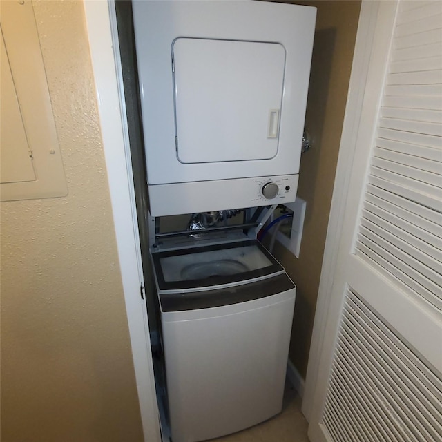 2011 Spenwick Dr Unit 220, Houston, TX 77055 - washroom with stacked washer / dryer and electric panel