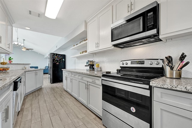 4358 Wildacres Dr, Houston, TX 77072 - kitchen featuring stainless steel appliances, decorative backsplash, white cabinetry, lofted ceiling, and open shelves