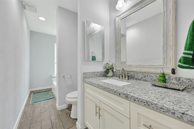4358 Wildacres Dr, Houston, TX 77072 - bathroom featuring vanity, a garden tub, and wood finish floors