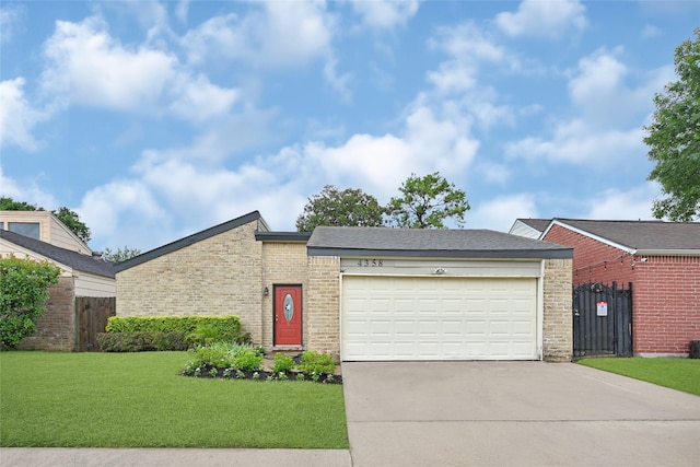 4358 Wildacres Dr, Houston, TX 77072 - mid-century home featuring concrete driveway, an attached garage, and brick siding
