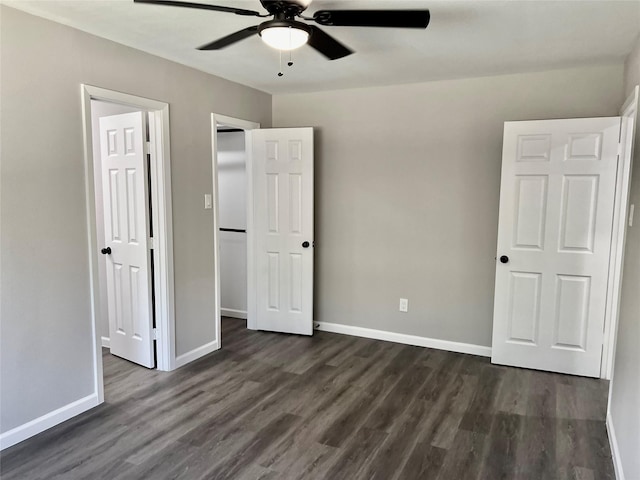 8826 Tanager St, Houston, TX 77036 - unfurnished bedroom with dark wood-style flooring and ceiling fan