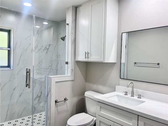 8826 Tanager St, Houston, TX 77036 - bathroom featuring vanity, a marble finish shower, recessed lighting, and a textured wall