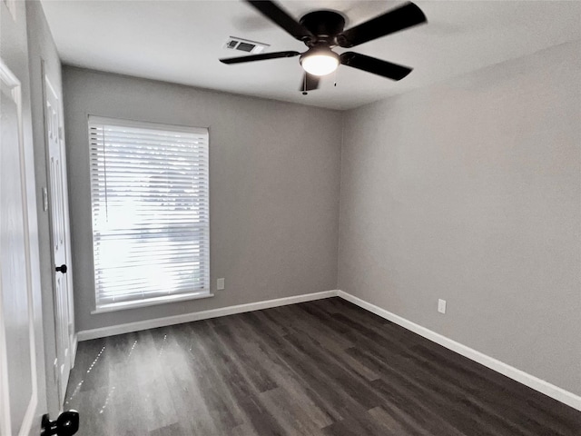 8826 Tanager St, Houston, TX 77036 - unfurnished room with dark wood-type flooring, healthy amount of natural light, and ceiling fan