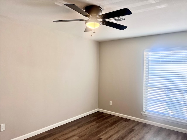 8826 Tanager St, Houston, TX 77036 - empty room featuring dark wood-style flooring and a ceiling fan