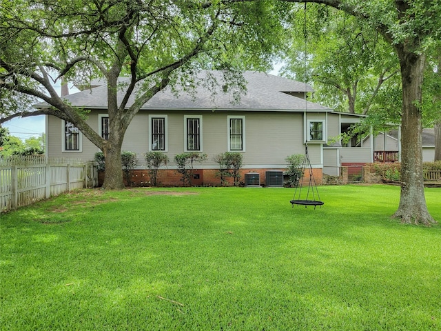 1406 Key St, Brenham, TX 77833 - back of house featuring roof with shingles and crawl space