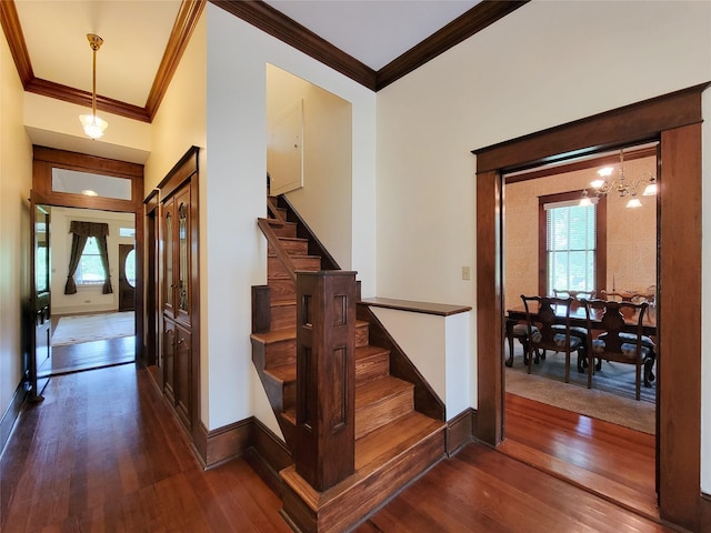 1406 Key St, Brenham, TX 77833 - stairway featuring crown molding, wood-type flooring, and healthy amount of natural light
