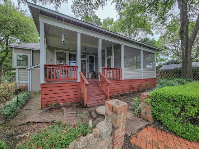 1406 Key St, Brenham, TX 77833 - view of front of property with a ceiling fan, stairs, a sunroom, and covered porch