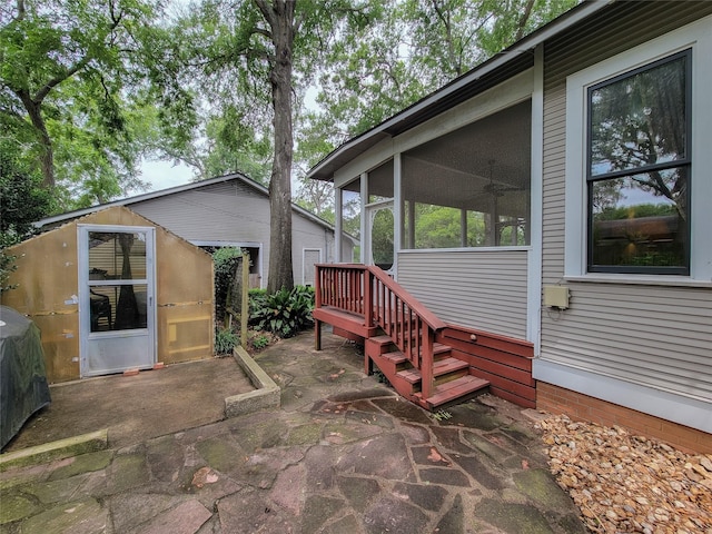 1406 Key St, Brenham, TX 77833 - view of patio featuring a shed and a sunroom