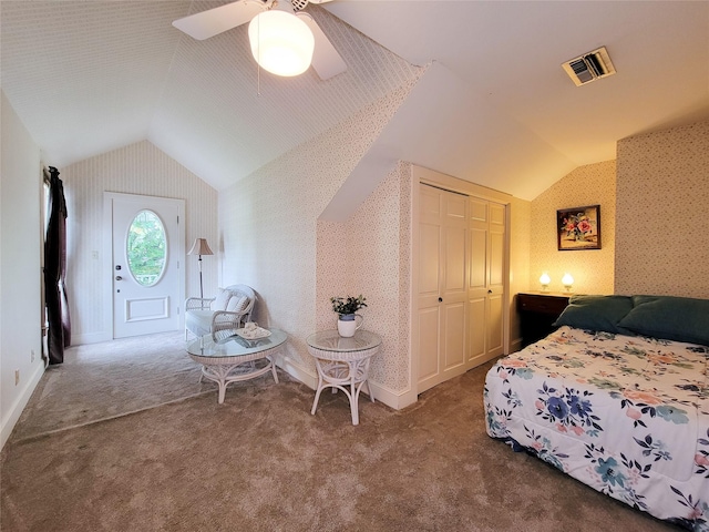 1406 Key St, Brenham, TX 77833 - bedroom featuring vaulted ceiling, wallpapered walls, carpet floors, a ceiling fan, and a closet