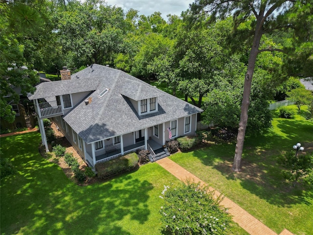 1406 Key St, Brenham, TX 77833 - view of front of property featuring roof with shingles, a chimney, covered porch, and a front yard