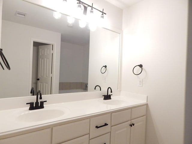 16861 Greenhouse St, Conroe, TX 77385 - bathroom featuring double vanity and a tub