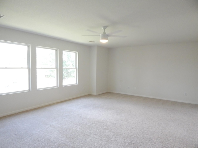 16861 Greenhouse St, Conroe, TX 77385 - spare room featuring light carpet and ceiling fan