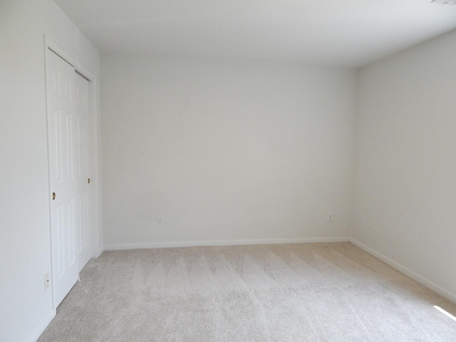 16861 Greenhouse St, Conroe, TX 77385 - unfurnished bedroom with light carpet and a closet