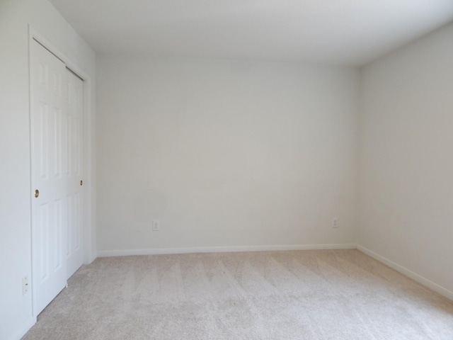 16861 Greenhouse St, Conroe, TX 77385 - unfurnished bedroom featuring light colored carpet and a closet