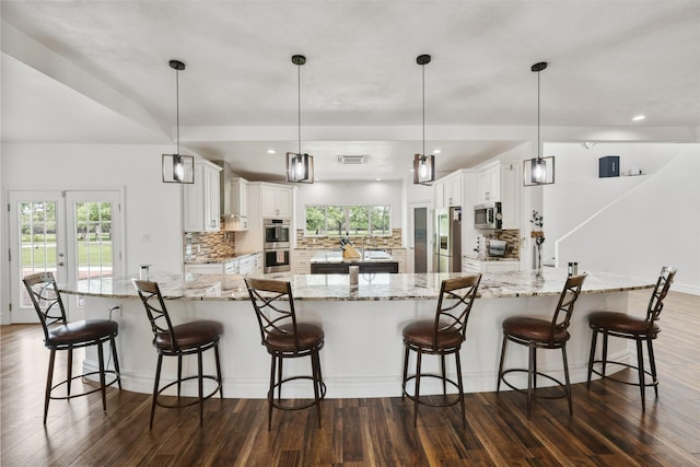 43919 Austin Branch Rd, Hempstead, TX 77445 - kitchen featuring stainless steel appliances, dark wood-style floors, tasteful backsplash, plenty of natural light, and recessed lighting