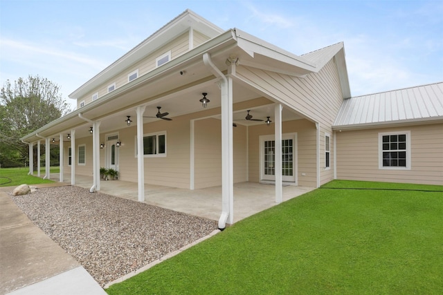 43919 Austin Branch Rd, Hempstead, TX 77445 - rear view of house featuring a ceiling fan, a yard, a metal roof, and a patio area