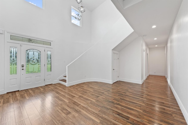 43919 Austin Branch Rd, Hempstead, TX 77445 - foyer featuring wood finished floors, stairway, recessed lighting, and a towering ceiling