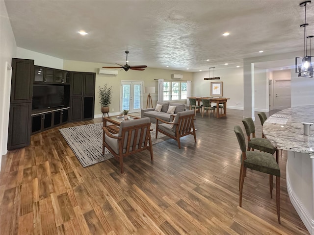 43919 Austin Branch Rd, Hempstead, TX 77445 - living area featuring a wall mounted AC, wood finished floors, recessed lighting, and a ceiling fan