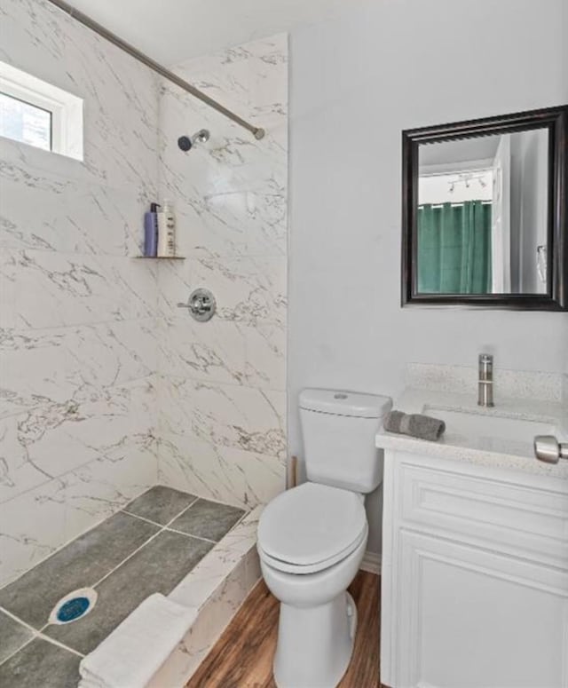 3709 Anita St, Houston, TX 77004 - full bath featuring vanity, a marble finish shower, and wood finished floors