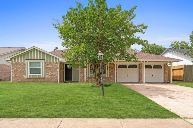 9403 Rentur Dr, Houston, TX 77031 - single story home with an attached garage, concrete driveway, brick siding, board and batten siding, and a shingled roof