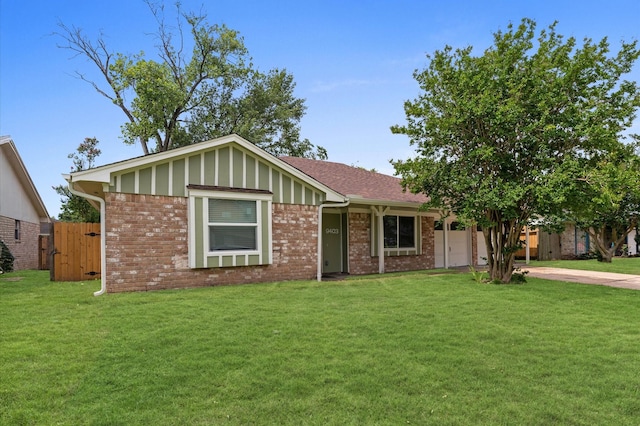 9403 Rentur Dr, Houston, TX 77031 - single story home with brick siding, a front lawn, concrete driveway, an attached garage, and board and batten siding