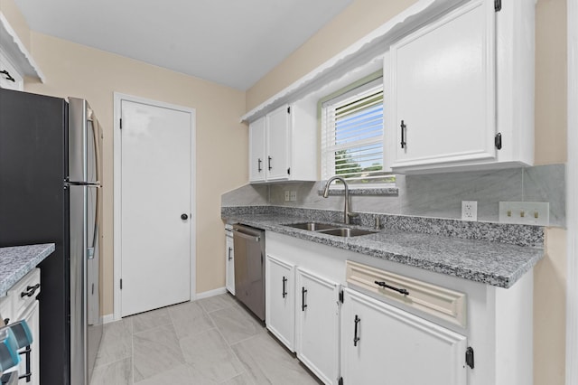 9403 Rentur Dr, Houston, TX 77031 - kitchen featuring appliances with stainless steel finishes, white cabinets, backsplash, and light stone countertops