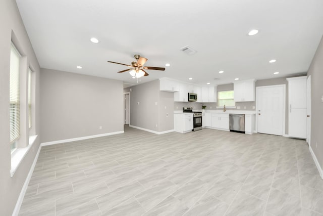 5722 Beldart St, Houston, TX 77033 - unfurnished living room featuring recessed lighting and ceiling fan