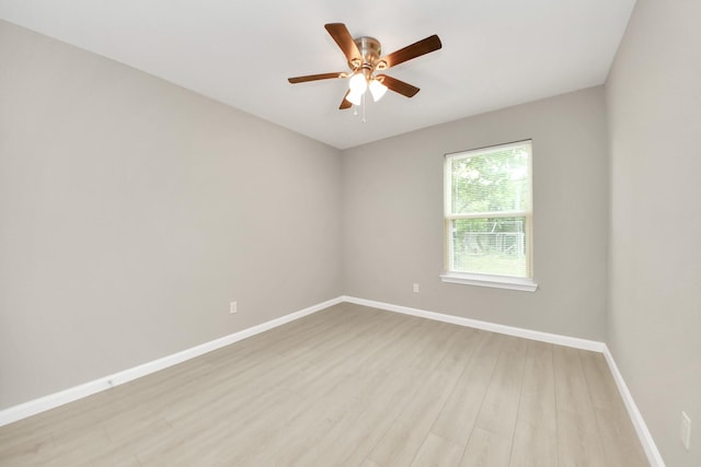5722 Beldart St, Houston, TX 77033 - empty room with light wood-style floors and a ceiling fan